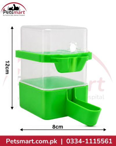 Green 300ml bird food and water dispenser with transparent reservoir measuring approximately 12cm by 8cm