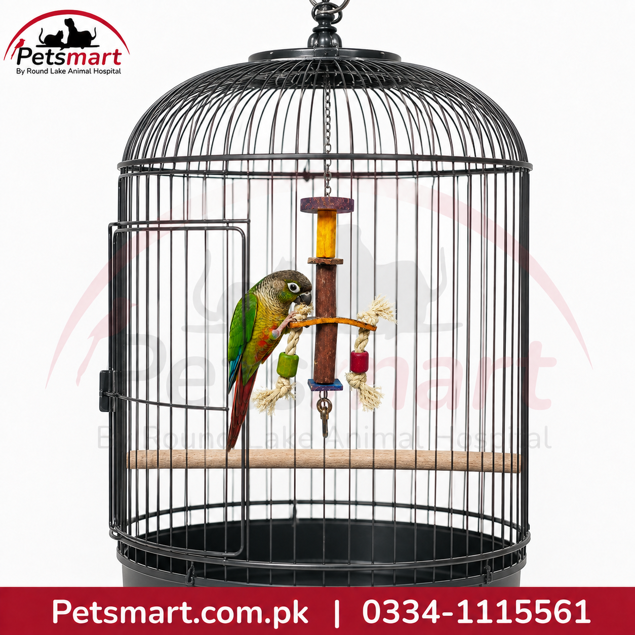 A black metal bird cage with a door, wooden perch, hanging toy, and hanging feeder, shown against a white background with Petsmart branding and contact details.