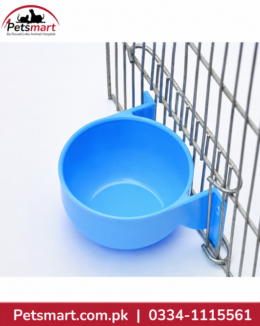 Blue round bird water bowl attached inside a bird cage