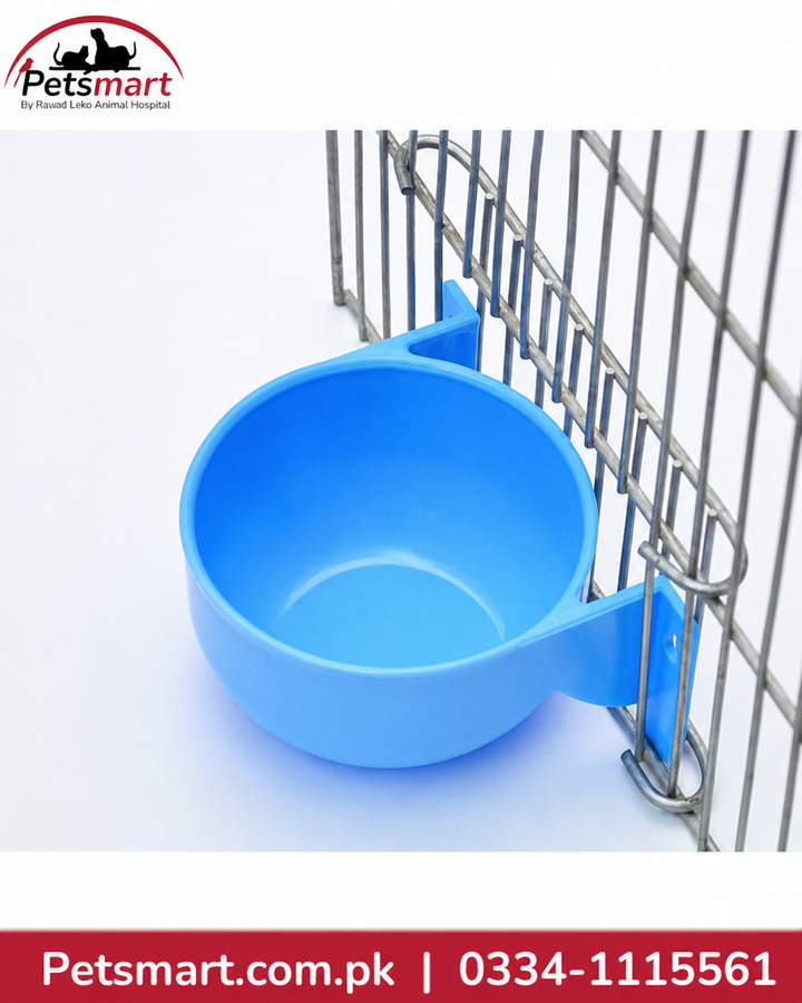 Blue round bird water bowl attached inside a bird cage