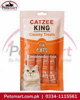 A stand-up pouch of Catzee King Creamy Treats for cats, shown on a white background with a Petsmart logo and watermark. The packaging is peach and orange with a photo of a cat on the front and a window displaying the treats inside.