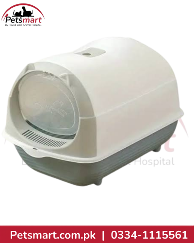 Small grey and white covered cat litter box with front door and matching litter scoop