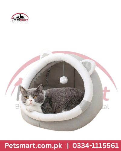 Cozy enclosed grey and white cat bed with hanging toy