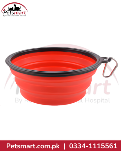 Red foldable travel dog bowl with black rim and metal carabiner clip