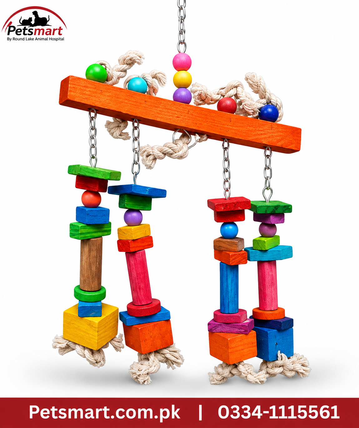 A colorful wooden bird toy with hanging chains, rope, and stacked wooden blocks in bright rainbow colors, shown on a white background with a Petsmart logo and contact banner.