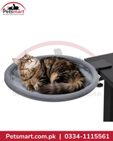 Large grey round cat bed attached to a black table with a clamp mounting bracket