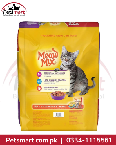 A bag of Meow Mix cat food in a bright yellow package with a photo of a gray tabby cat on the front. The Meow Mix logo is visible in red script, and a Petsmart logo appears in the top left corner.