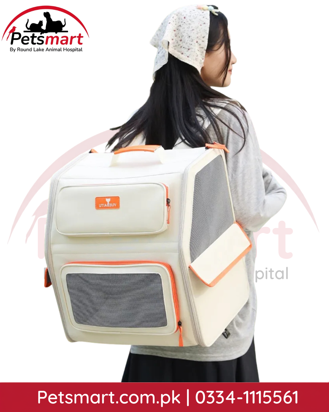 Cream pet carrier bag being carried by top handle for convenient pet travel