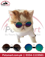 A fluffy cream and brown cat wearing round mirrored sunglasses and a white shirt, with two pairs of round pet sunglasses shown below on a white background. Petsmart branding is visible.