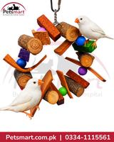A bird toy wreath made of natural wood logs, branches, and colorful plastic balls, with two white birds perched on it. The image has a 'Petsmart' logo in the top-left corner and a red contact banner at the bottom.
