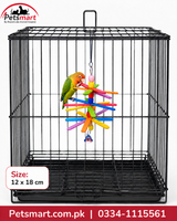 A black metal bird cage with a hanging colorful parrot toy, featuring a green and orange parrot perched on the toy. The image includes a Petsmart logo in the top-left corner and a size label indicating 12 x 18 cm.